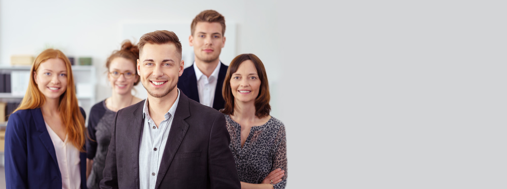 young businessman with colleagues in office